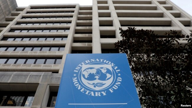 FILE - The International Monetary Fund headquarters building in Washington.