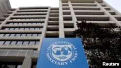 FILE - The International Monetary Fund headquarters building in Washington, U.S., April 8, 2019. 