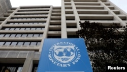 FILE - The International Monetary Fund headquarters building in Washington, U.S., April 8, 2019. 