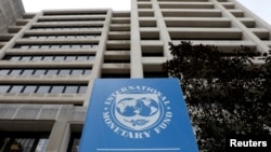 FILE - The International Monetary Fund headquarters building in Washington, U.S., April 8, 2019. 