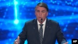 Incumbent President Jair Bolsonaro, who is running for re-election, speaks during a presidential debate in Sao Paulo, Brazil, Aug. 28, 2022. Brazil will hold general elections on Oct. 2.