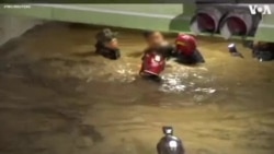 Rescuers Save Two Victims from Flooded Car Park in Seoul 