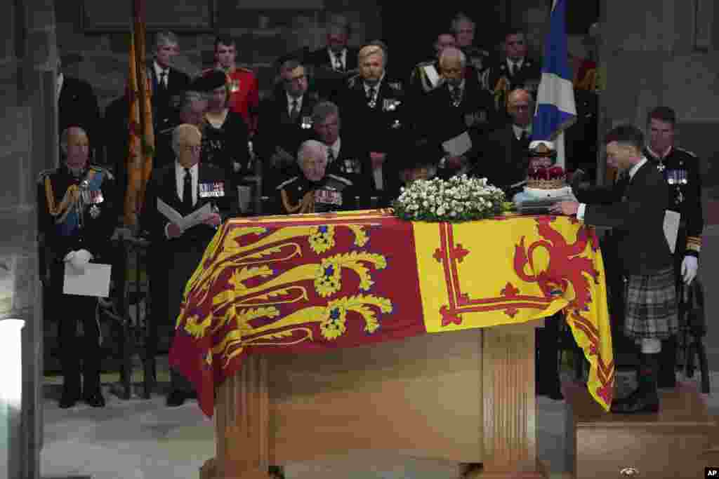 From left, Prince Edward, Prince Andrew, King Charles III, Camilla, the Queen Consort, Princess Anne and Vice Admiral Sir Tim Laurence, look on as the Duke of Hamilton places the Crown of Scotland on the coffin during the Service of Prayer and Reflection&nbsp;for the Life of Queen Elizabeth II at St. Giles&#39; Cathedral, Edinburgh, Sept. 12, 2022.