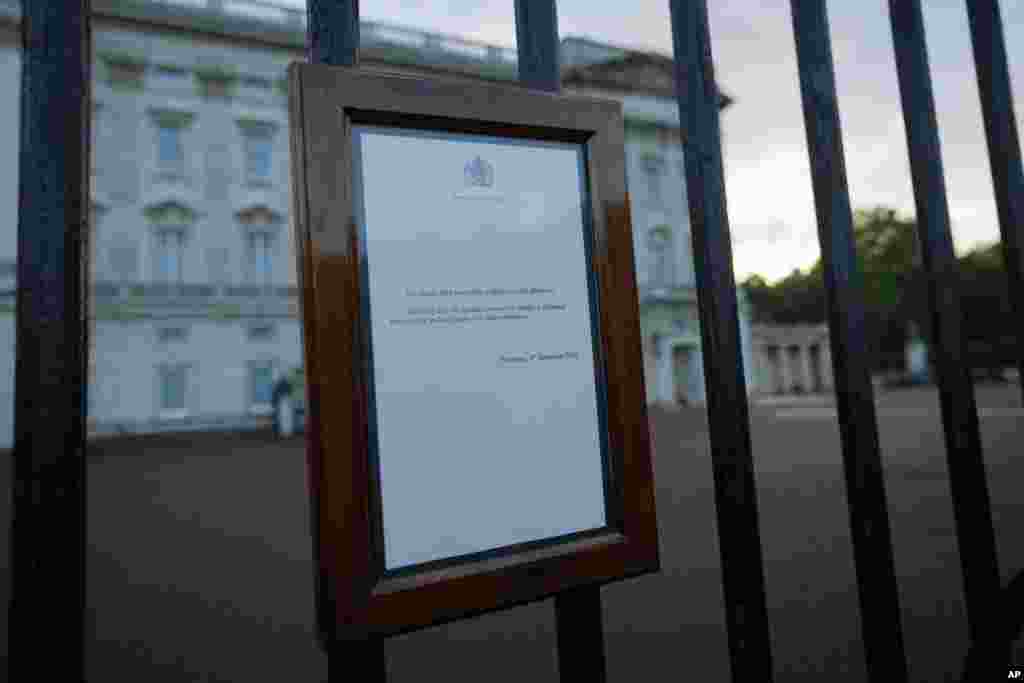 An announcement regarding the death of Britain's Queen Elizabeth II is displayed on the gates of Buckingham Palace in London, Sept. 8, 2022.