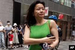 FILE - Cheng Lei, a Chinese-born Australian journalist for CGTN, the English-language channel of China Central Television, attends a public event in Beijing, Aug. 12, 2020. She was detained in China on national security charges in August, 2020.