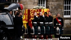 The hearse carrying the coffin of Britain's Queen Elizabeth arrives at the Palace of Holyroodhouse in Edinburgh, Scotland, Sept. 11, 2022. 