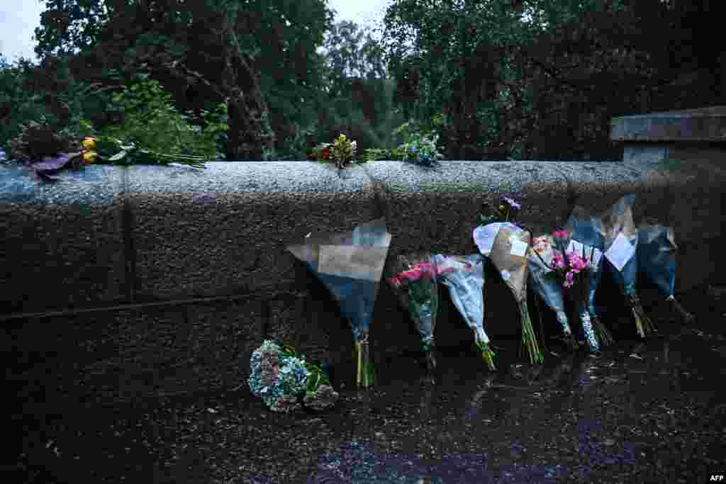 Floral tributes are pictured on the road outside the Balmoral Estate in Ballater, Scotland, on Sept. 8, 2022.