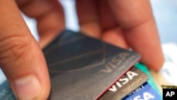 FILE - Visa credit cards are seen Aug. 11, 2019, in New Orleans.