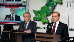 In this handout photo released by Pakistan Prime Minister Office, Prime Minister Shahbaz Sharif, right, with U.N. Secretary-General Antonio Guterres during a joint press conference at the Prime Minister House in Islamabad, Pakistan, Sept. 9, 2022.