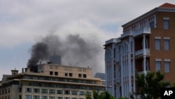 FILE - Smokes rises from the roof of a hotel after their privately-owned diesel generator catches fire in Beirut, Lebanon, July 12, 2022. 