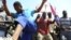 Striking mine workers protest outside the Anglo American Mine in Rustenburg, South Africa, October 5, 2012.