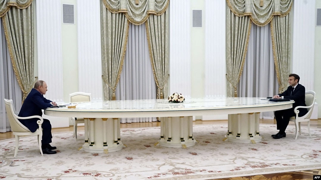 French President Emmanuel Macron (R) meets with Russian President Vladimir Putin (L) in Moscow on Feb. 7, 2022, for talks in an effort to find common ground on Ukraine and NATO.