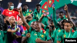 Cameroon players celebrate after finishing in third place, Feb. 5, 2022.