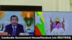 Screens showing Cambodia's Prime Minister Hun Sen and Commander-in-Chief of Myanmar's armed forces, Senior General Min Aung Hlaing attend a video call at Peace Palace in Phnom Penh, Cambodia, Jan. 26, 2022.