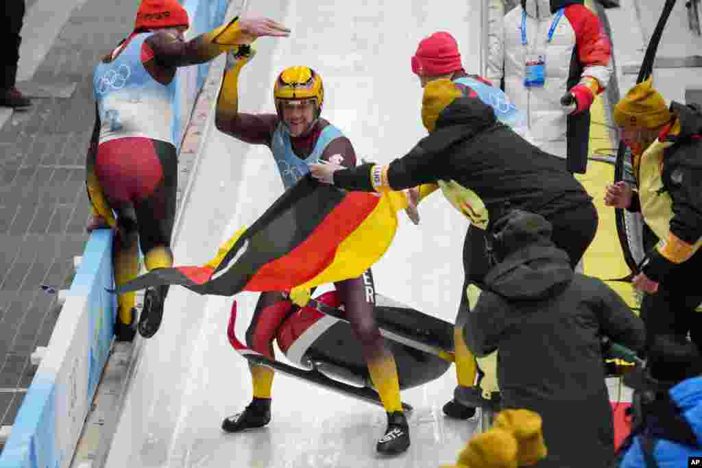 Johannes Ludwig of Germany celebrates winning the gold medal in luge men&#39;s singles at the 2022 Winter Olympics in the Yanqing district of Beijing.