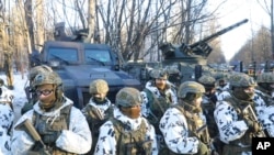 Ukrainian armed forces simulate an urban crisis in the abandoned city of Pripyat near the Chernobyl nuclear plant, Ukraine, Feb. 4, 2022. 