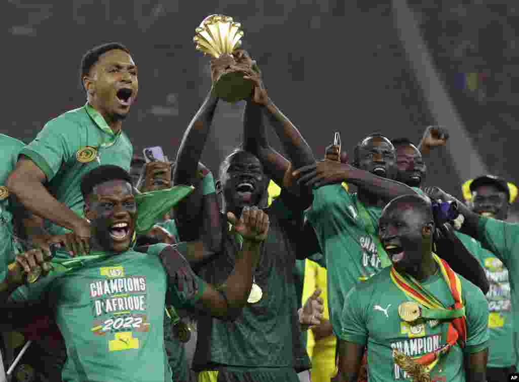 Senegal&#39;s players celebrate after winning the final soccer match against Egypt, Feb. 6, 2022.