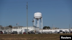 FILE - The exterior of a Pilgrim's poultry processing plant in Enterprise, Alabama, Nov. 30, 2021. 