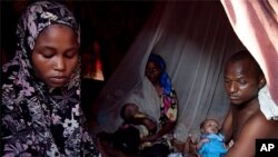 Maryan Jamal Ali gave birth to twins in her tent in Sayidka IDP camp, Mogadishu, Somalia. Photo taken December 13, 2011.