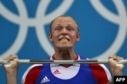 FILE - Russia's Andrey Demanov competes during the men's 94kg group A weightlifting event of the London 2012 Olympic Games at The Excel Centre in London on August 4, 2012.