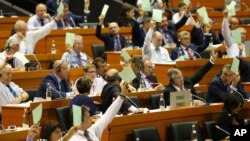 NATO's Parliamentary Assembly participants unanimously vote on a declaration calling on alliance members at the July summit to provide reassurance to those allies who feel their security is under threat, focusing on the eastern and southern flanks of the alliance, in Tirana on May 30, 2016.