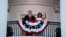 President Donald Trump and first lady Melania Trump stand on the Truman Balcony of the White House as they watch a fireworks display during a 'Salute to America' event, July 4, 2020, in Washington.