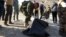 A member of Iraqi security forces put in a plastic bags the remains of people killed by the Islamic State group that were found in a mass grave on Jan. 26, 2016, a day after it was discovered in the Al-Jamiya area of central Ramadi. 