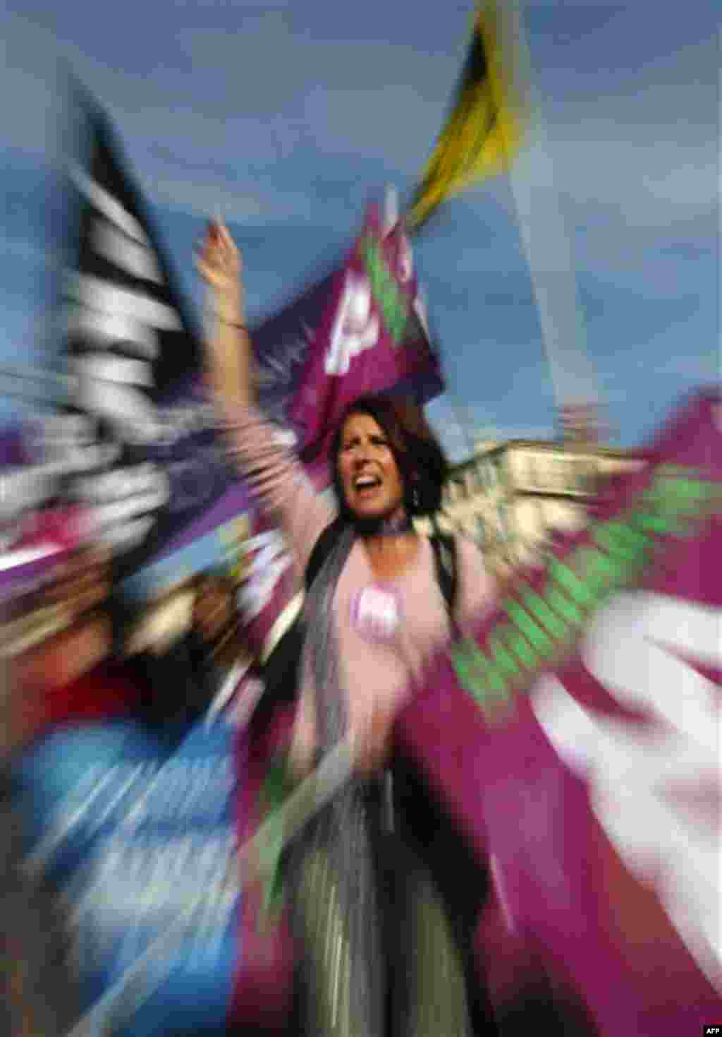 A woman shouts slogans during a demonstration in Marseille, southern France, Thursday, Oct. 28, 2010. Thursday saw more nationwide street protests and strike-caused travel woes even though parliament has already approved President Nicolas Sarkozy's unpopu