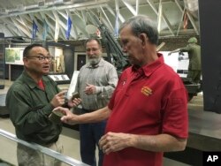 Vietnam veteran Dallas Brown, right, talks about food rations during the war with Tom Hara of the Fort Campbell Historical Foundation, at Fort Campbell, Kentucky, Oct. 27, 2017.