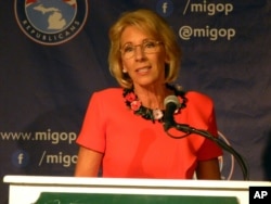 Betsy DeVos speaks Friday during a Republican conference in Michigan.