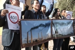 Activists stage a protest against man-made emissions of carbon dioxide and other global warming gases, at the COP22 climate change conference in Marrakech, Nov 16, 2016.