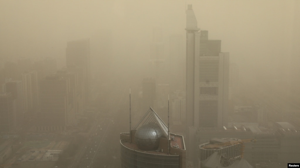 FILE - A general view shows the skyline of Beijing, China, shrouded in smog, March 15, 2021. (REUTERS/Tingshu Wang)