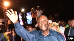 Ivory Coast president Alassane Ouattara waves to supporters after his victory in the presidential election, Oct. 28, 2015, in Abidjan. 