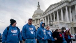 As the impeachment trial of President Donald Trump is conducted inside the Senate, activists attending the March for Life anti-abortion rally visit the Capitol in Washington, Thursday, Jan. 23, 2020.