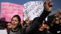 Indian students shout slogans and demand severe punishment for rapists as they condemn the gang-rape of a student in New Delhi during a protest in Jammu, India, December 21, 2012.
