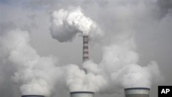 Cooling towers of a coal-fired power plant in Dadong, Shanxi province, China, 03 Dec 2009