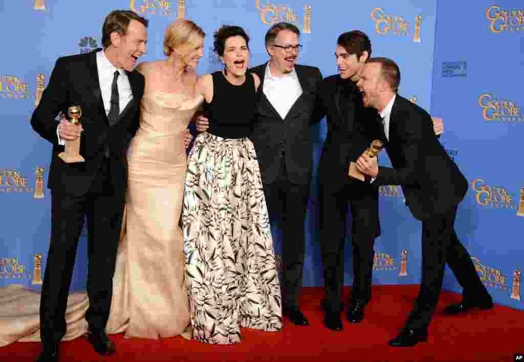 From left, Bryan Cranston, Anna Gunn, Betsy Brandt, Vince Gilligan, RJ Mitte, and Aaron Paul pose in the press room with the award for best TV series - drama for &quot;Breaking Bad&quot; at the 71st annual Golden Globe Awards at the Beverly Hilton Hotel, California, Jan. 12, 2014.