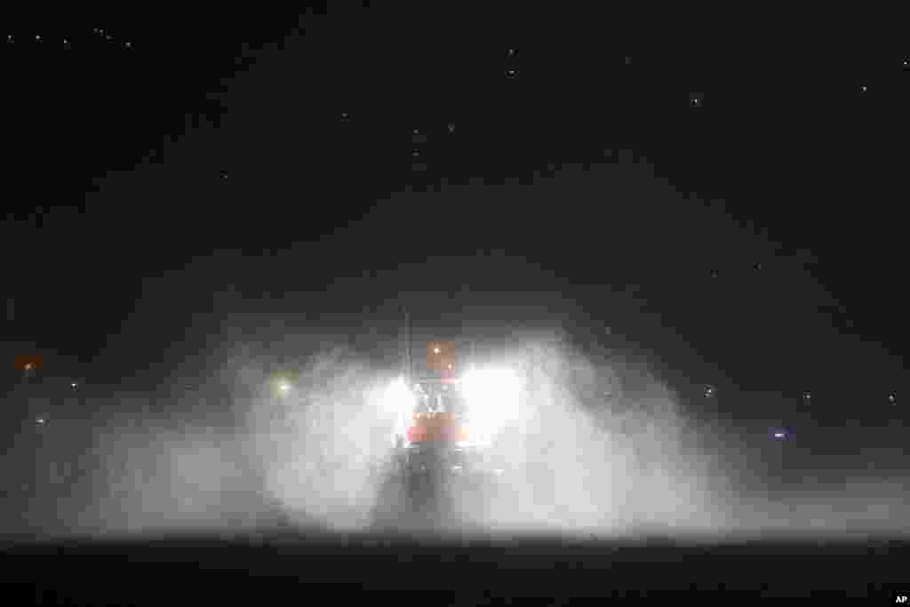 A fishing boat is seen during heavy rain and strong winds at the port in Horta, on the Portuguese island of Faial. Hurricane Lorenzo is hitting the mid-Atlantic Azores Islands with strong rain, powerful winds and high waves.