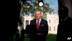 White House press secretary Sean Spicer prepares to go on cable news on the North Lawn of the White House in Washington, April 11, 2017. Spicer apologized for making an "insensitive" reference to the Holocaust in earlier comments about Syrian President Bashar al-Assad's use of chemical weapons.