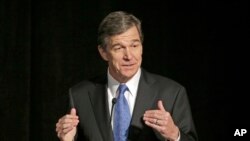 FILE- Democratic Gov.-elect Cooper announced Monday that legislators will hold a special session to repeal the law known as HB2 that limits protections for LGBT people. 