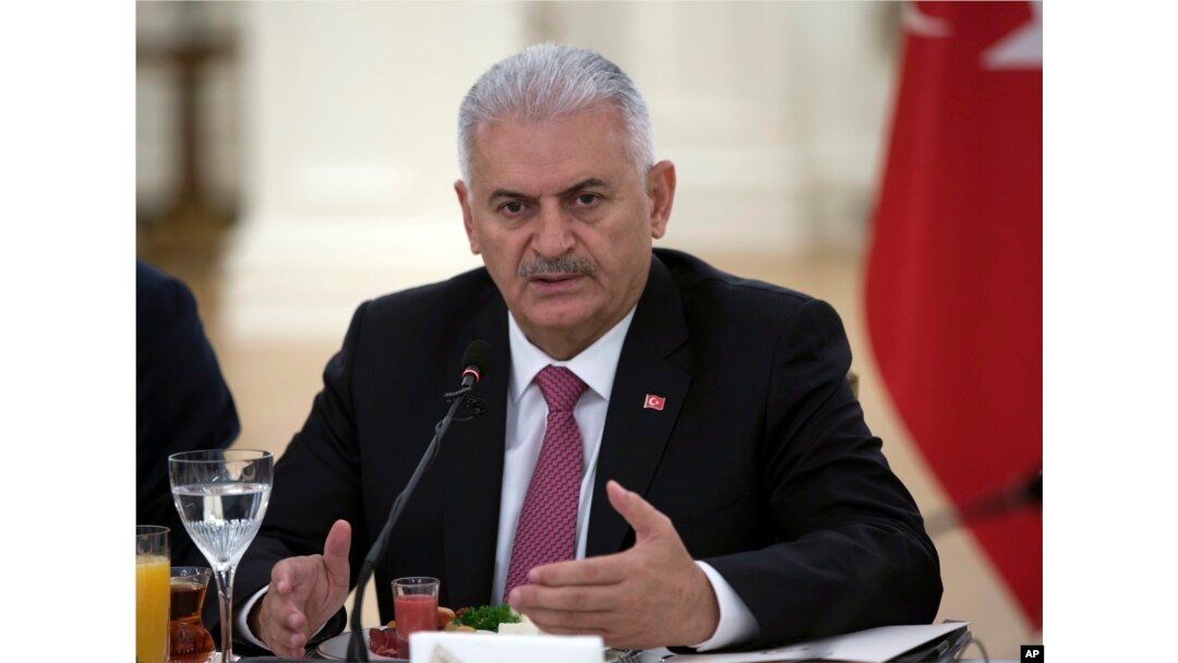 FILE - Turkish Prime Minister Binali Yildirim speaks during a meeting with representatives of German companies, in Ankara, Turkey, July 27, 2017.