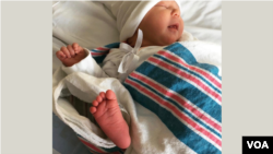 Newborn baby, Dorothy Jane, shows off her new little foot! (Courtesy Photo from her Grandmother)