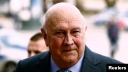 South Africa's former president Frederik Willem de Klerk arrives at a news conference one day ahead of the 13th World Summit of Nobel Peace Prize Laureates in Warsaw Oct. 20, 2013. 