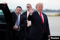U.S. President Donald Trump arrives to board Air Force One to return to Washington at the conclusion on their holiday vacation, from Palm Beach International Airport in West Palm Beach, Florida, Jan. 1, 2018.