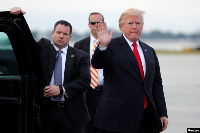U.S. President Donald Trump arrives to board Air Force One to return to Washington at the conclusion on their holiday vacation, from Palm Beach International Airport in West Palm Beach, Florida, Jan. 1, 2018.
