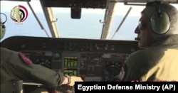 An Egyptian plane searches in the Mediterranean Sea for the missing EgyptAir flight 804 plane, which crashed after disappearing from the radar early Thursday while carrying 66 passengers and crew from Paris to Cairo, in video image released May 19, 2016.