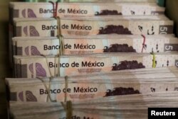 Bundles of Mexican peso banknotes are pictured at a currency exchange shop in Ciudad Juarez, Mexico, Jan. 15, 2018.