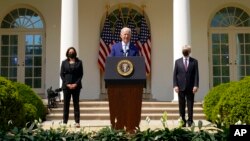 President Joe Biden, accompanied by Vice President Kamala Harris, and Attorney General Merrick Garland, speaks about gun violence prevention in the Rose Garden at the White House, Thursday, April 8, 2021, in Washington. (AP Photo/Andrew Harnik)