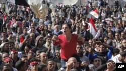 An Egyptian protester shouts anti-government slogans during a protest in Tahrir Square in Cairo, Egypt, February 8, 2013.