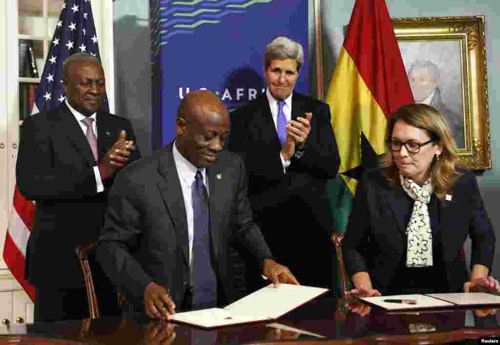 (L-R) Ghana President John Dramani Mahama, Ghana Finance Minister Seth Terkper, U.S. Secretary of State John Kerry and Dana Hyde, CEO of the Millennium Challenge Corporation (MCC), participate in the Ghana Compact Signing Ceremony at the State Department, Washington, DC, Aug. 5, 2014.